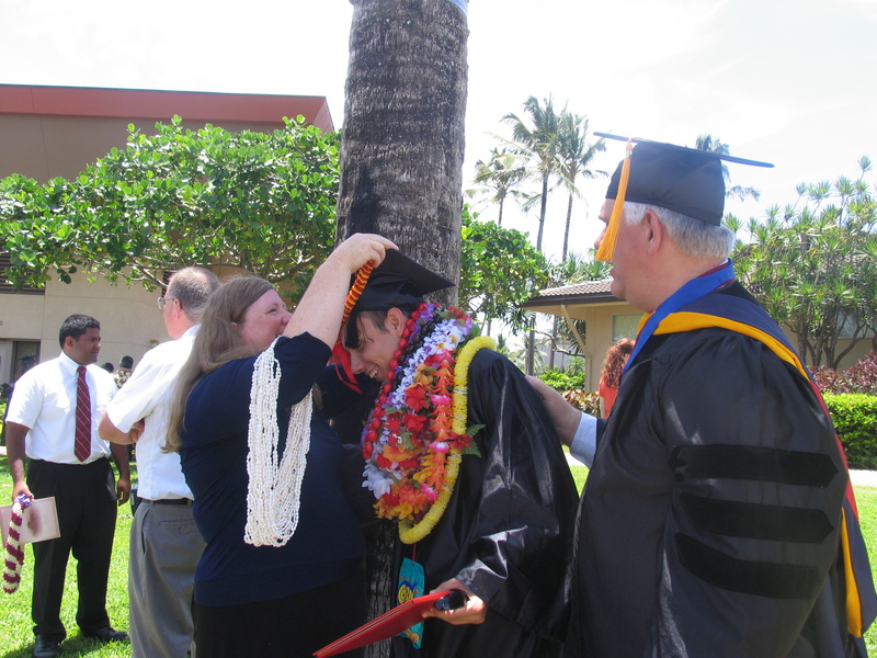 Lois giving Matt a lei with Don watching