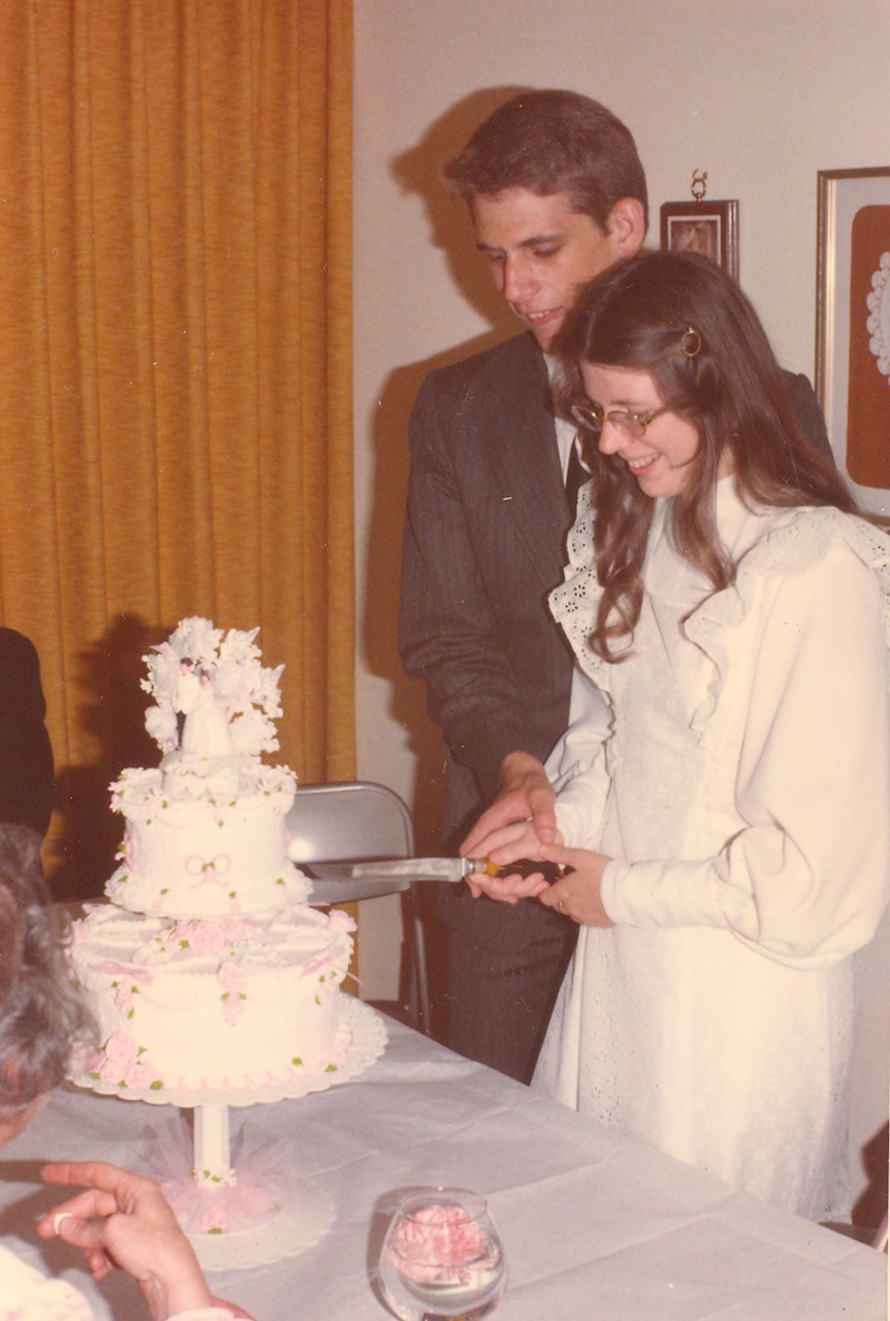 Lois cutting the Cake; Don holding hands :-)