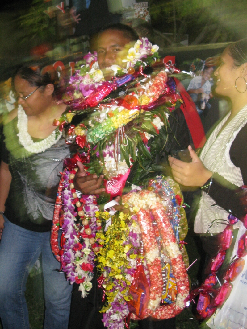 He has to carry his leis.