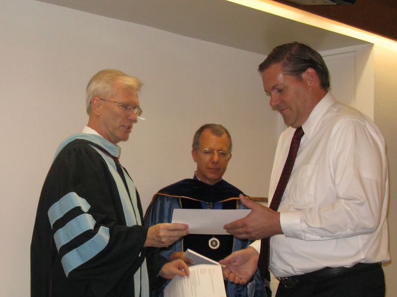 Bill Neal presents certificate to Brent Chowen.