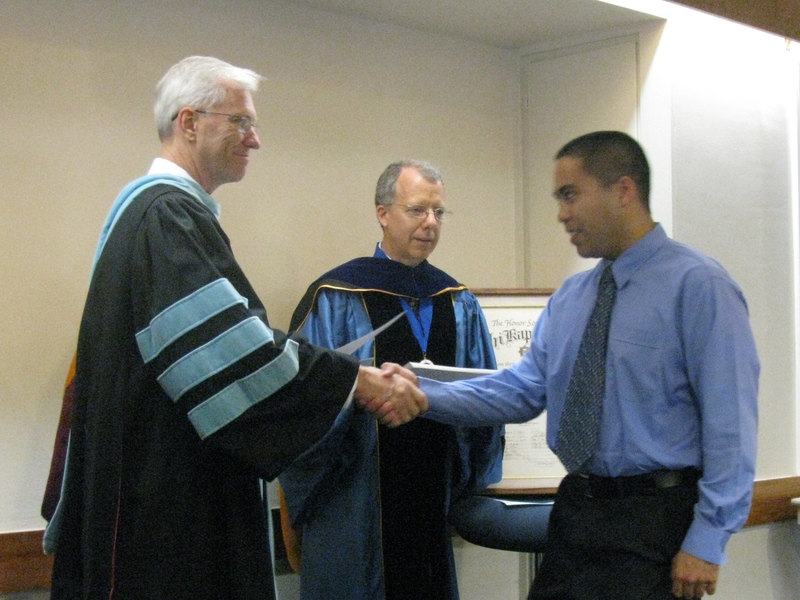 Bill Neal presents certificate to Michael Baysa.