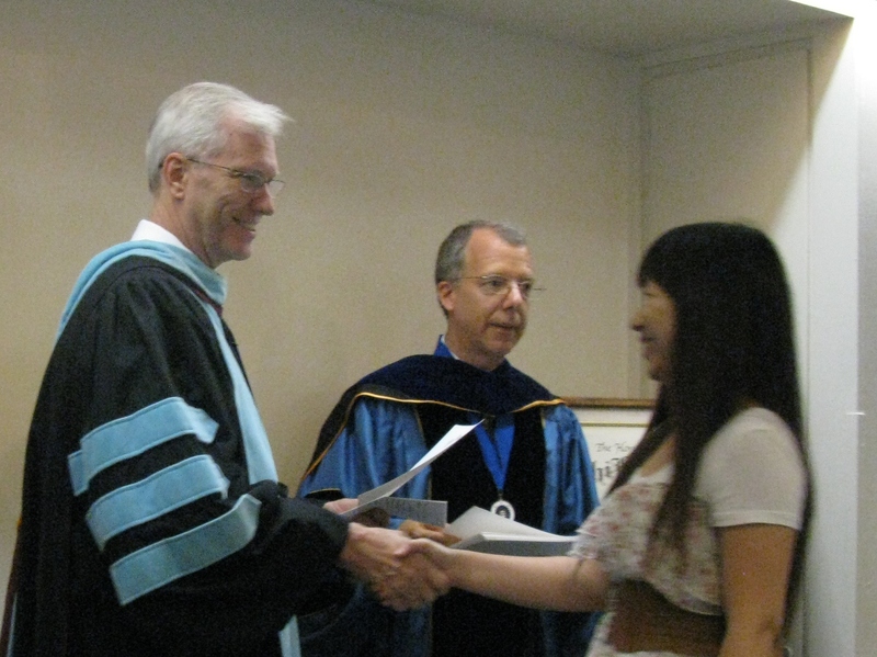 Bill Neal presents certificate to Wai Chi Chan.