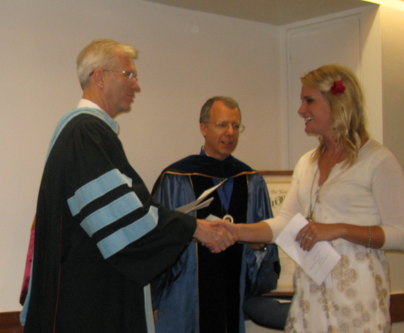 Bill Neal presents certificate to Nicole Clark.