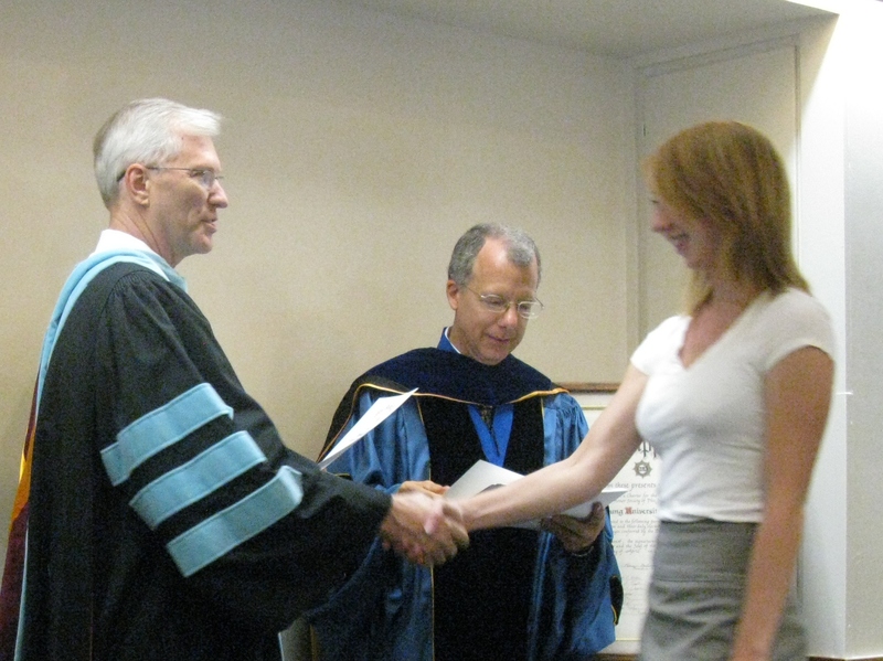 Bill Neal presents certificate to Amanda Hansen.