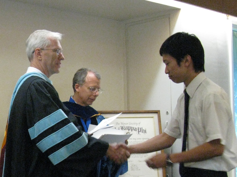 Bill Neal presents certificate to Shinji Naganuma.