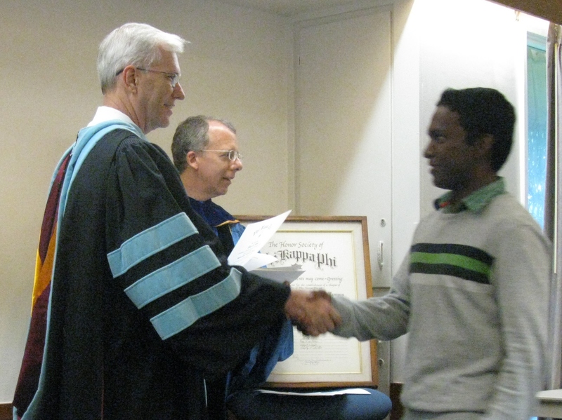 Bill Neal presents certificate to Vijay Patha.