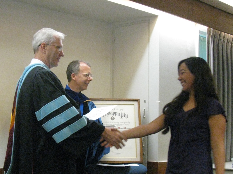 Bill Neal presents certificate to Carla Rada Prudencio.