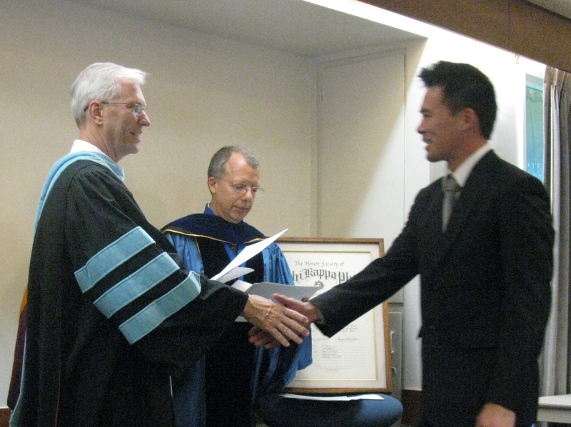 Bill Neal presents certificate to David Ryan.