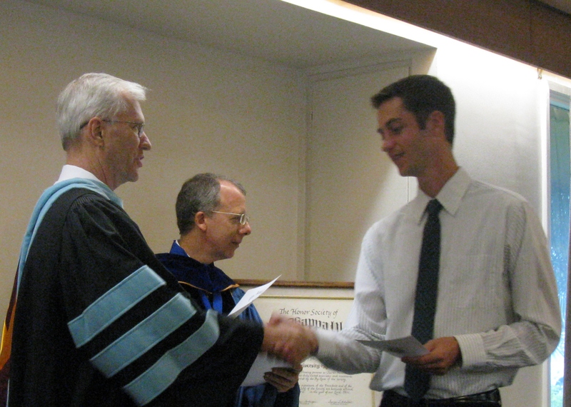 Bill Neal presents certificate to Jonathan Smith.