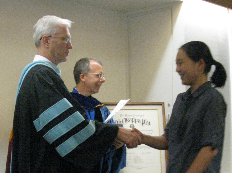 Bil Neal presents certificate to Chrissie Suwanto.