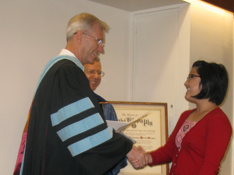 Bill Neal presents certificate to Vanessa Tandiman.
