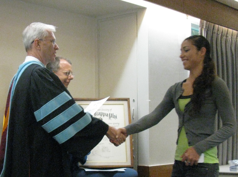 Bill Neal presents certificate to Myana Welch.
