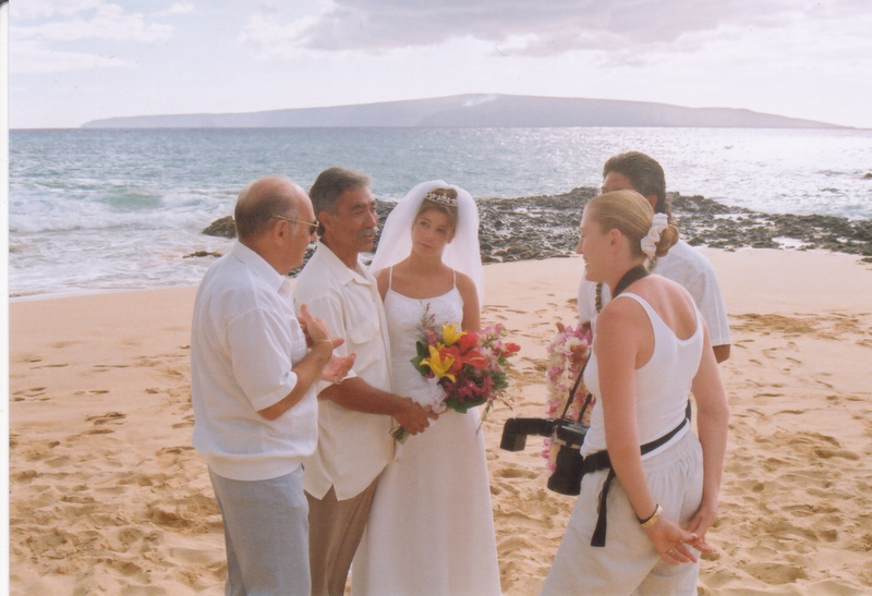 Conferring with the minister and photographer.
