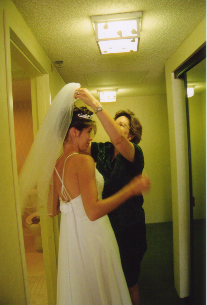 Cindy dressing Rachel in her wedding dress.