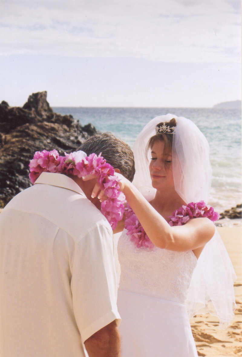 Jim Hawver receives a lei from Rachel.