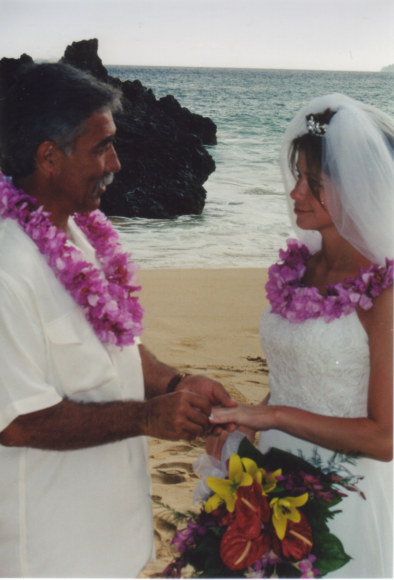 Jim places a ring on Rachel's finger.