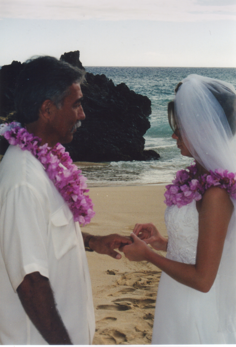 Rachel places a ring on Jim's finger.