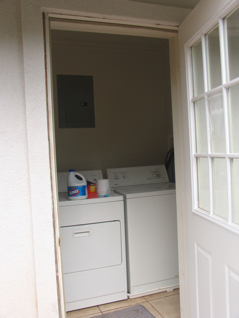 Laundry room with washer and dryer. Looks like electrical box on wall.