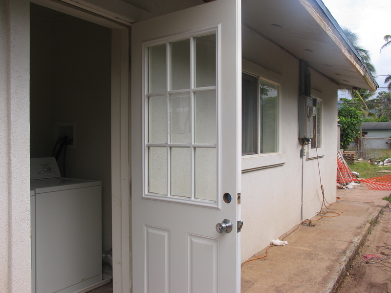 West outside door, which leads to landryroom and another door inside the house.