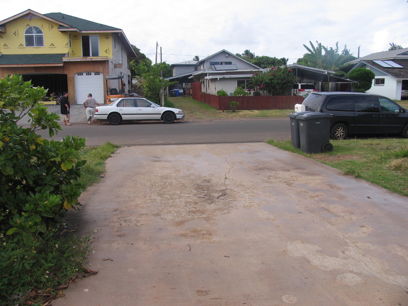 Front driveway looking towards street. Notice dumpsters.