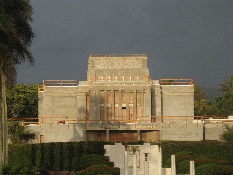 Our temple used to be white. It is under renovation. Notice the railing added everywhere.