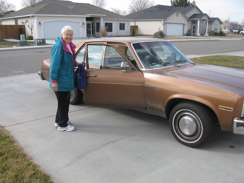 Mom and her car. It's vintage now.