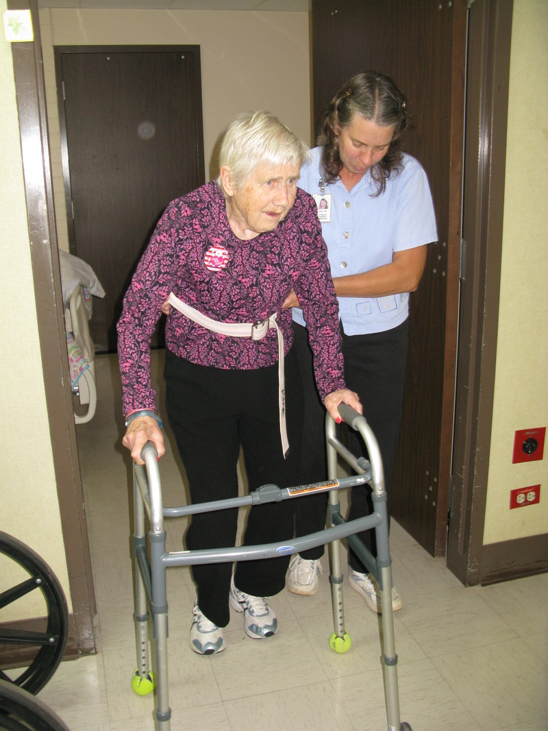 Mom graduated from the parallel bars to a walker. Here's she's out for her first spin.