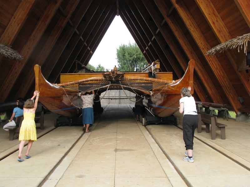 Pushing the Iosepa, the sailing canoe at the Polynesian Cultural Center.