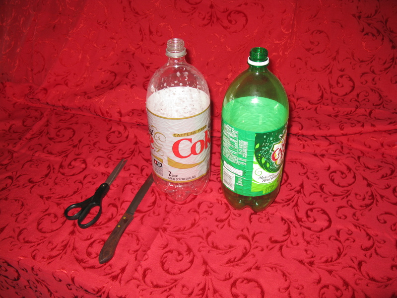 Supplies: scissors, knife, and two liter bottle.