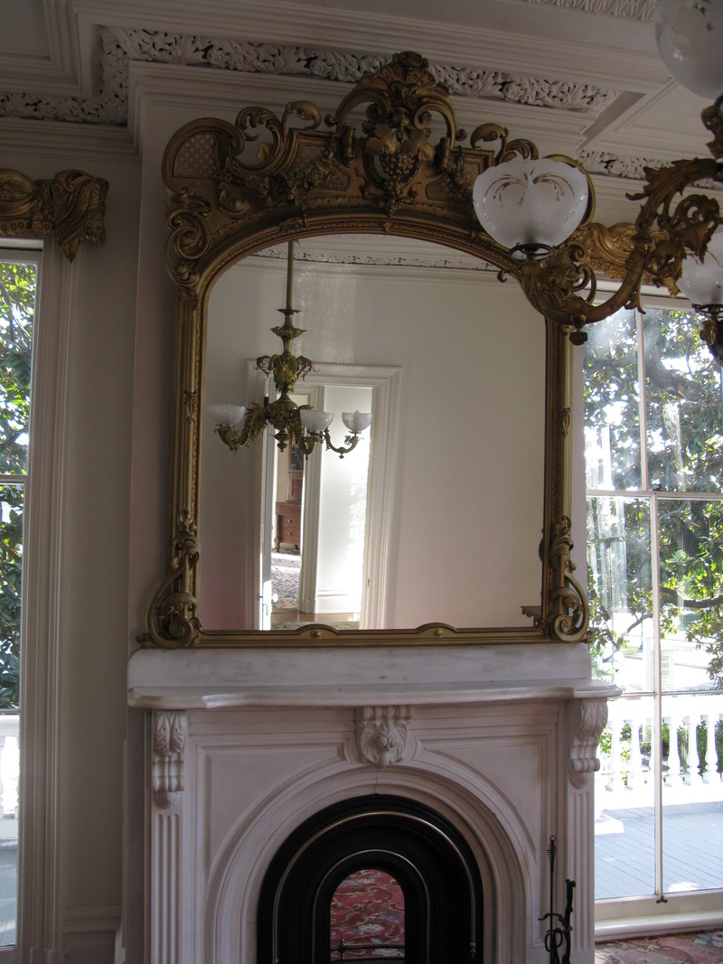 The mirrors above the fireplaces were ornate.