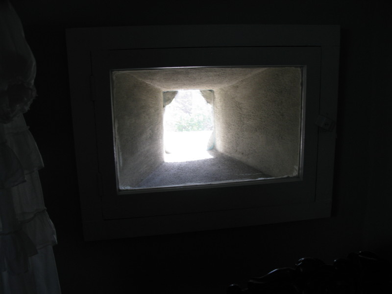window in the Latimer House, top floor. You can see the thickness of the wall. I have never seen a window that shape before.
