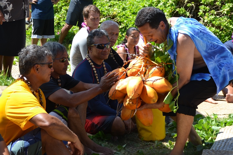 Nainoa Thompson receiving the coconuts