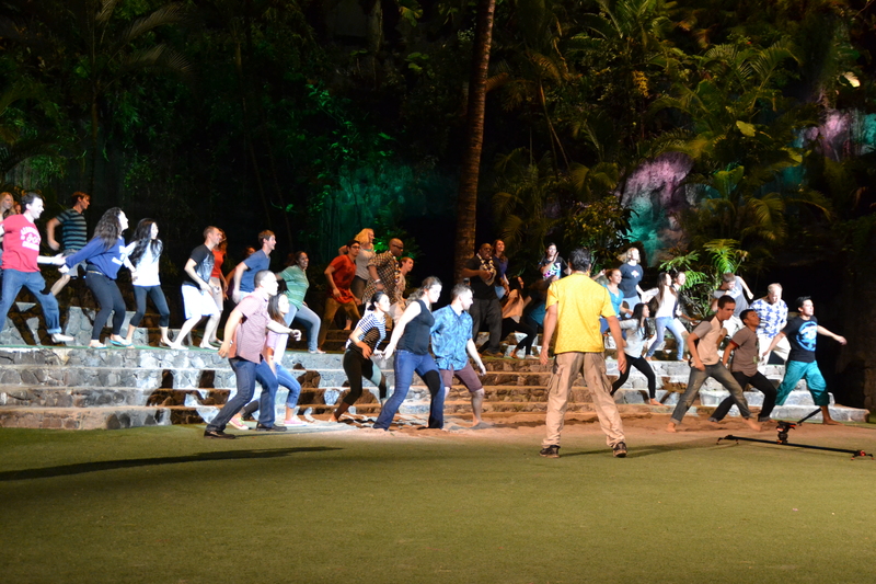 Shaun Parry is teaching them some choreography steps to the volunteers that came to be in the video.