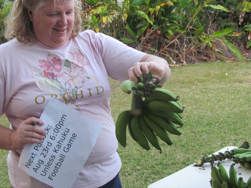 Lois is showing off the little whorl that got one half banana on it. It also has another whorl on the stalk.