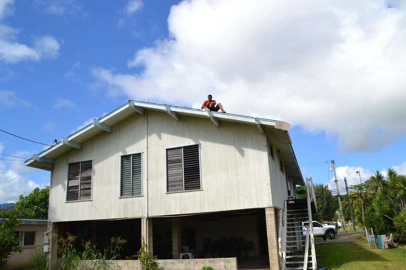 Padding the beams so they do not rip the tarps.