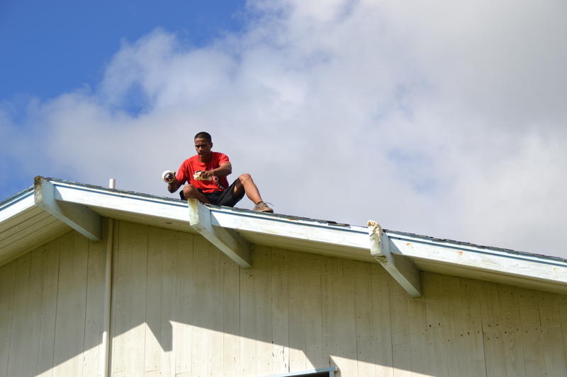 Padding the beams so they do not rip the tarps.