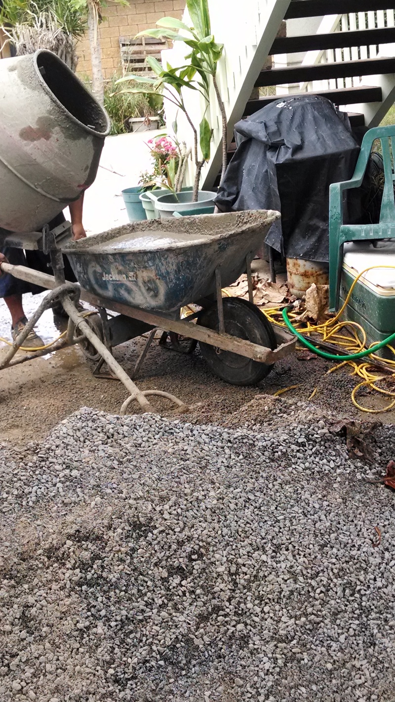 The YM came to move the pile of sand and gravel mix that was left after the pillars were replaced.