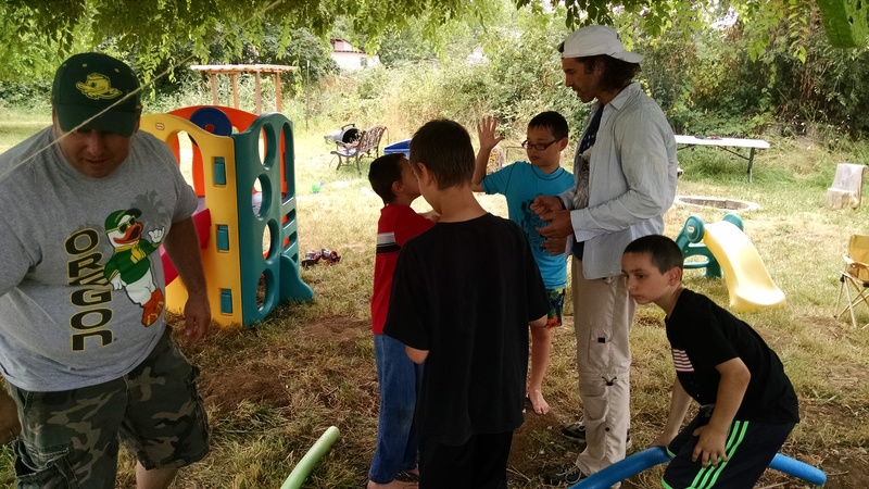 Ron Williams and Shaun Parry helping the children get ready for the pinata bashing.