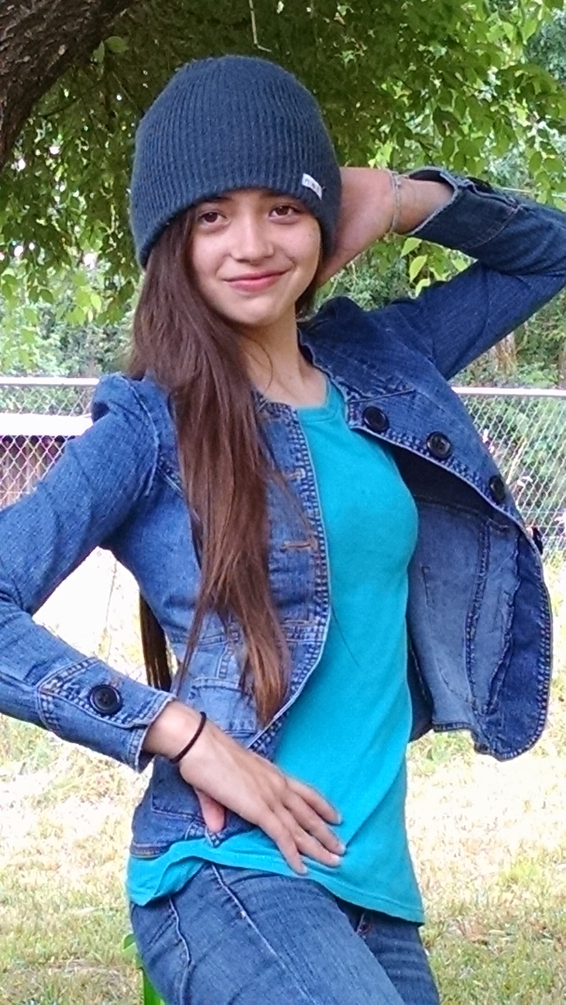 Tia and her 4th of July outfit. As soon as she saw grandma with her camera out, she stuck a pose. :-)
