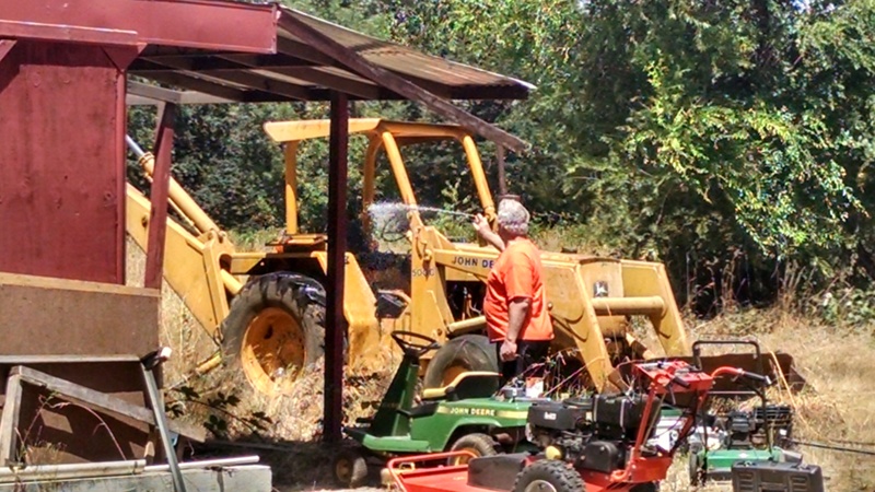 Meanwhile Chuck and Don were going to work on the backhoe that won't start, but some yellow jackets had taken up residence in the toolbox and several vertical posts.