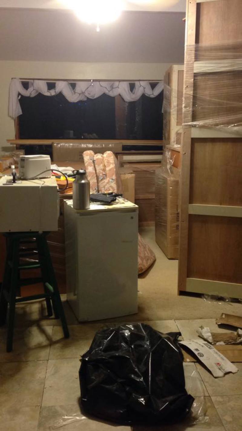 Meanwhile back in Laie the house is progressing. Here are the kitchen cabinets sitting in the living room.
