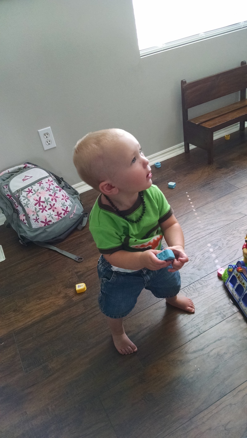 Austin is learning to stand by himself.