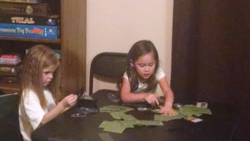 Cassi and Adele playing a game.