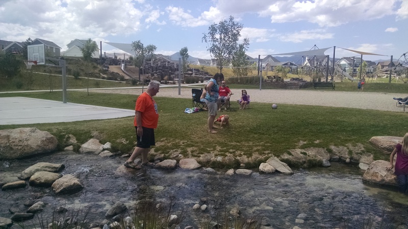 Don walking in the creek.