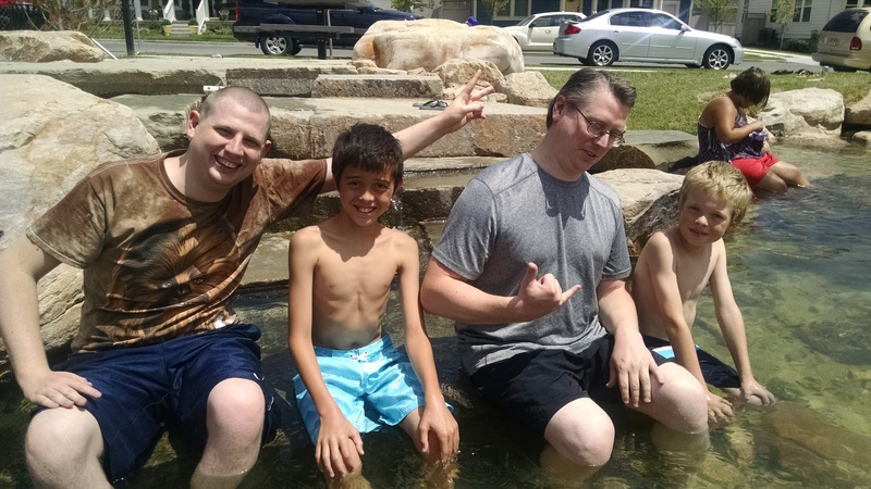 Isaac, Mikey, Ben, and Caleb chillin' on a rock.