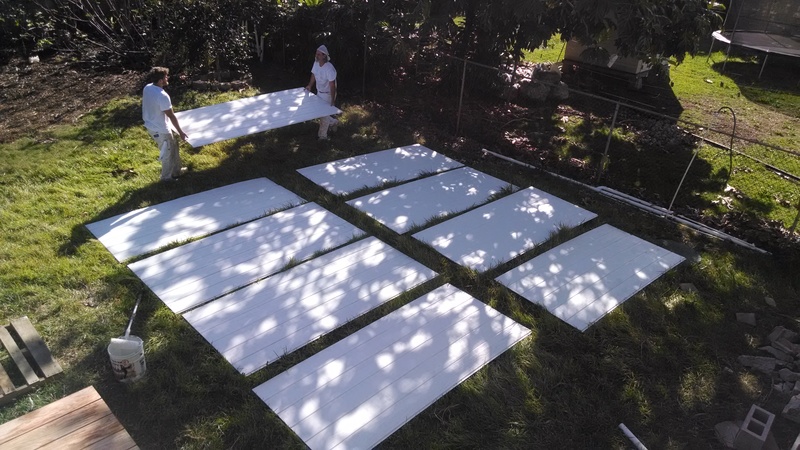 Primer paint has been appied and the panels are being laid out to dry in the sun.