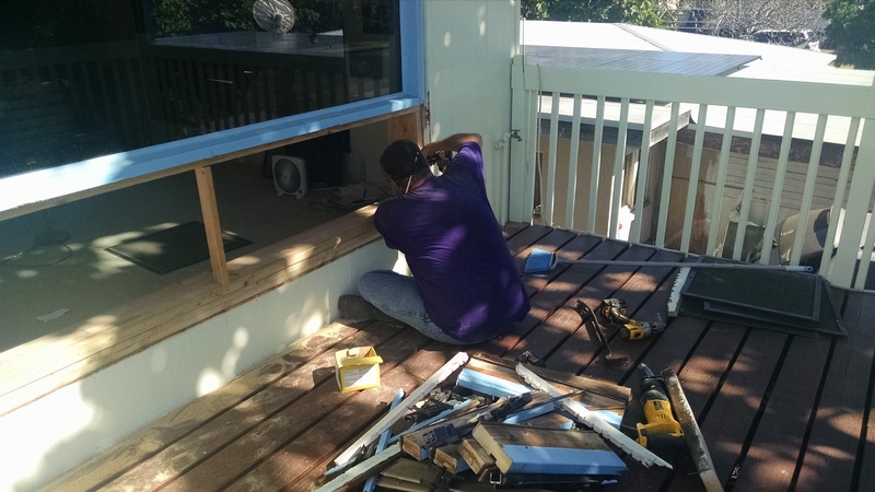 Carl working on the South West Living room window.