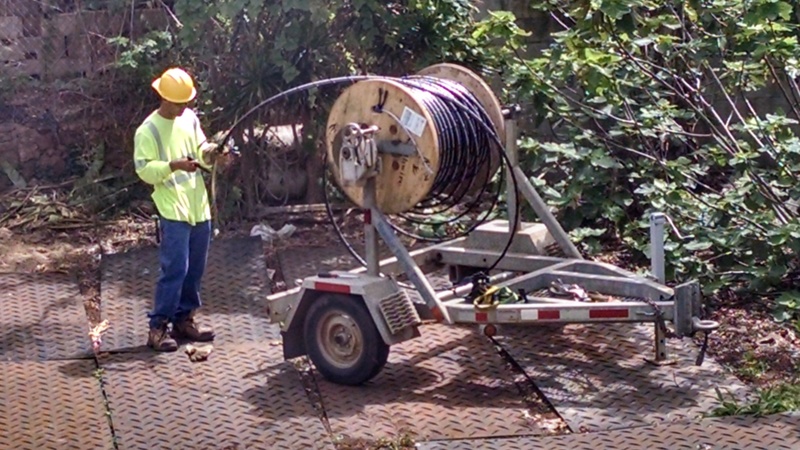 Stringing cable down the middle of the block. They had our power off for over six hours.