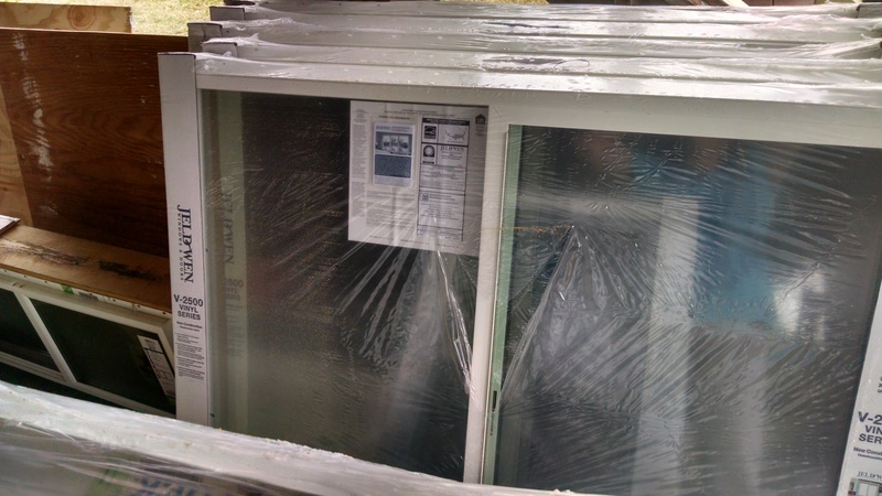 Stack of windows waiting to be installed in the house.