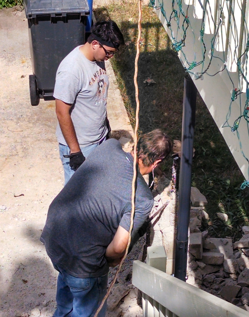 NW pillar. Carl working on the post.